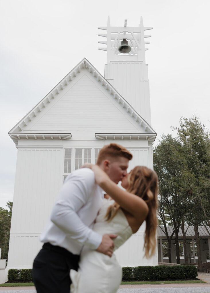 bride and groom kiss at the Seaside chapel