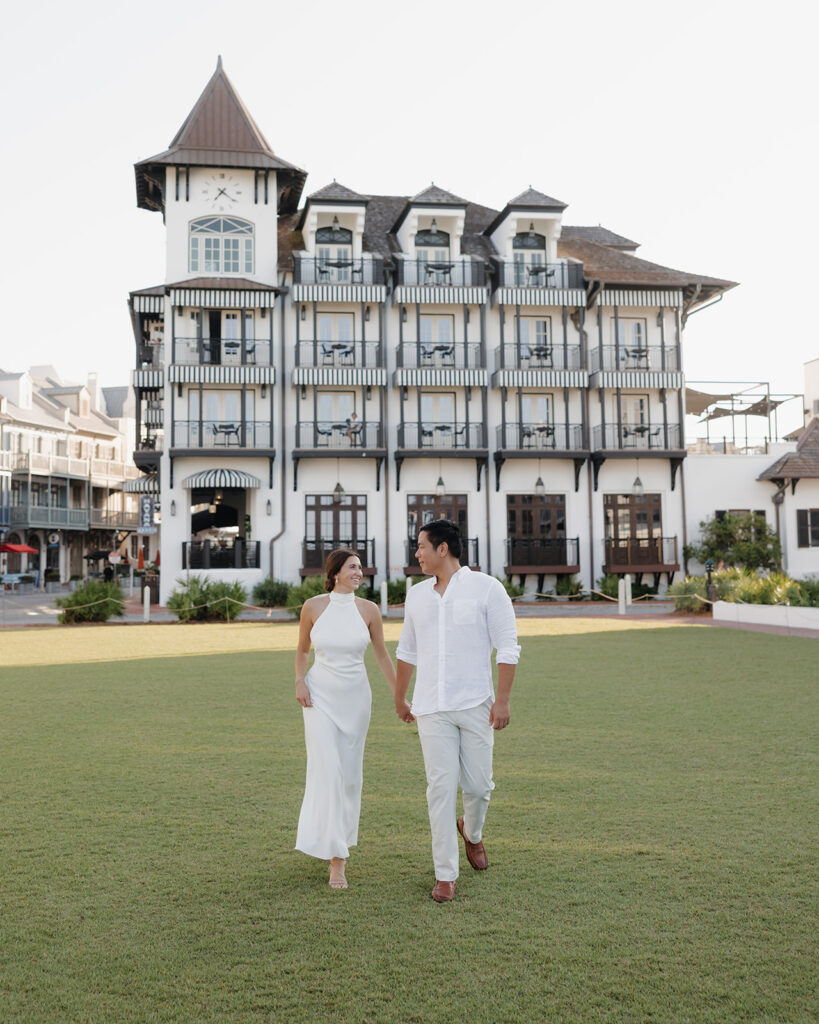 man and woman walk by the Pearl in Rosemary Beach FL