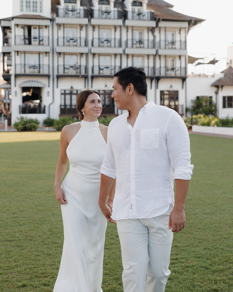 man leads woman next to Pearl Rosemary Beach