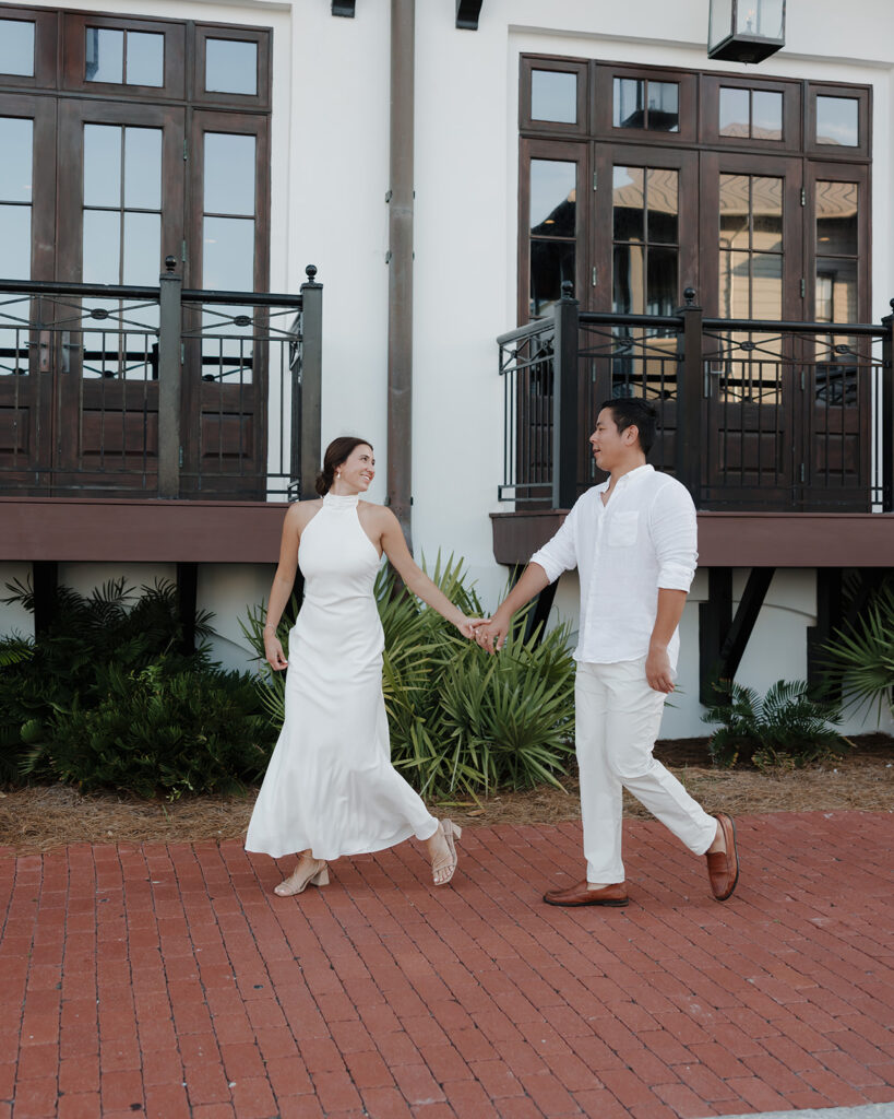 woman leads man into the Pearl Rosemary Beach 