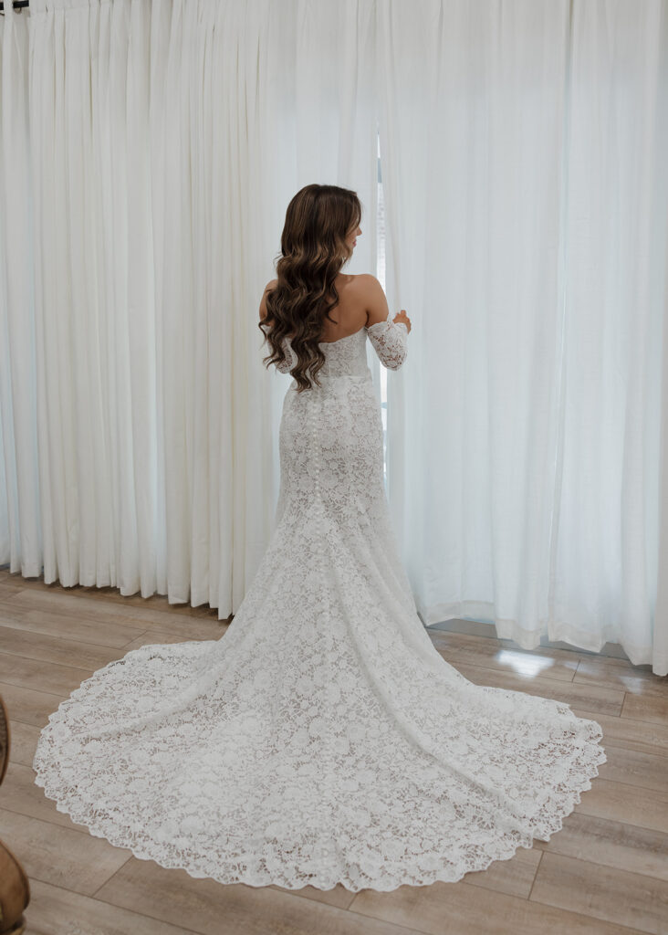 bride peeks out the window