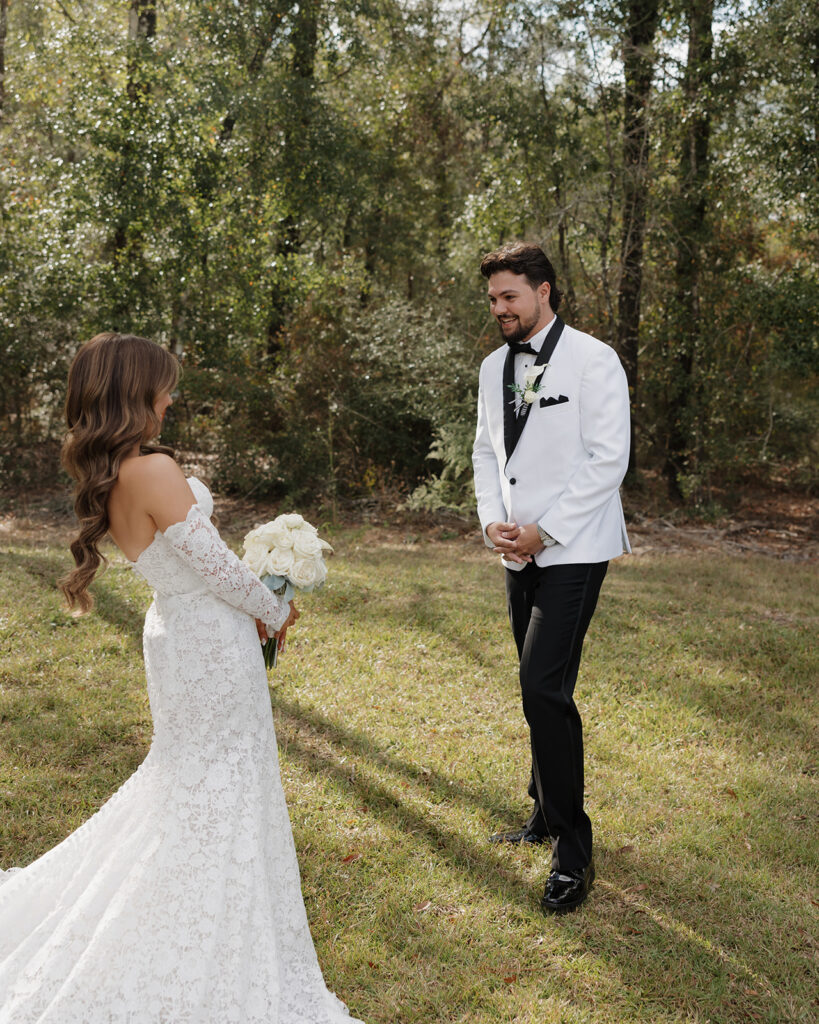 groom smiles when seeing the bride