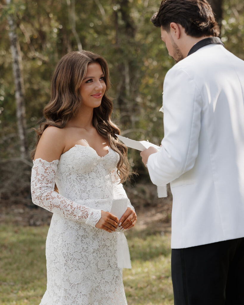 bride and groom read vows