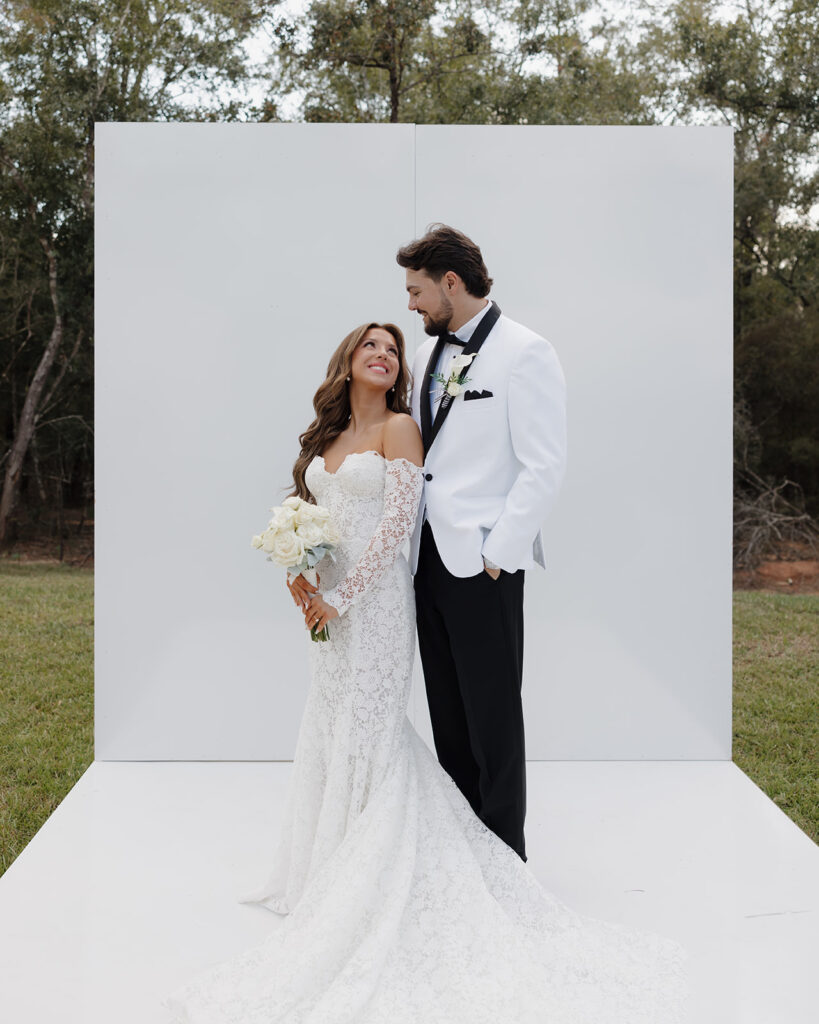 bride and groom smile