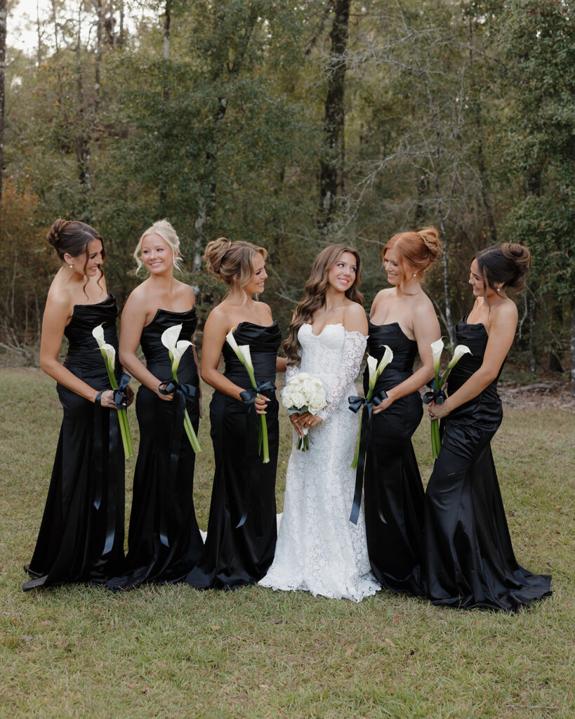 bride smiles at her bridesmaids