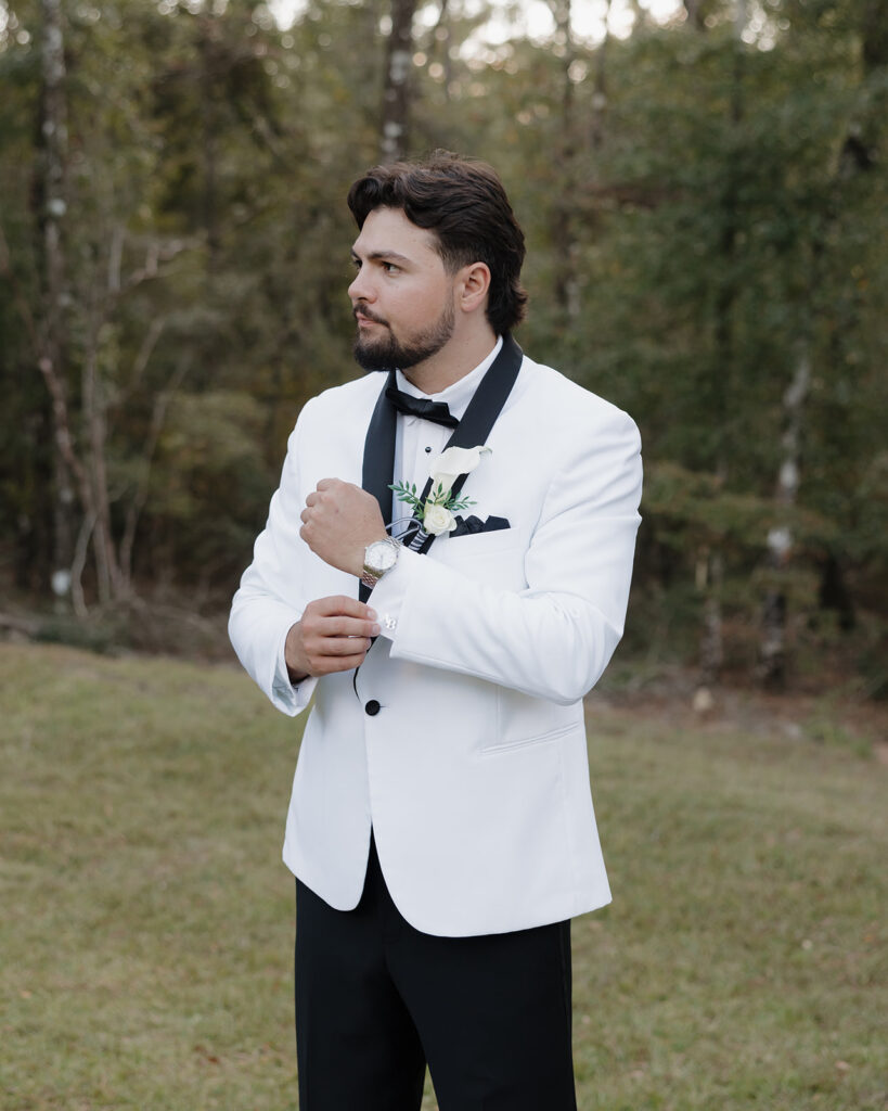 groom adjusts his watch