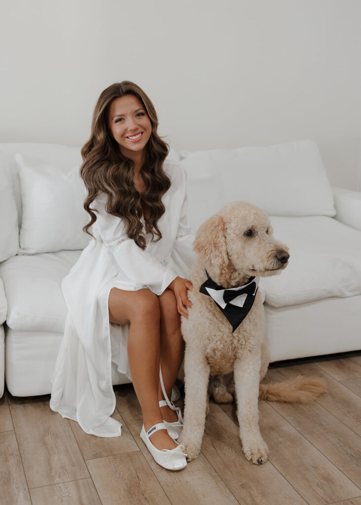 bride poses with her dog