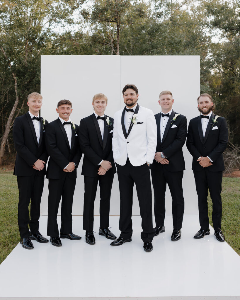 groom and groomsmen smile