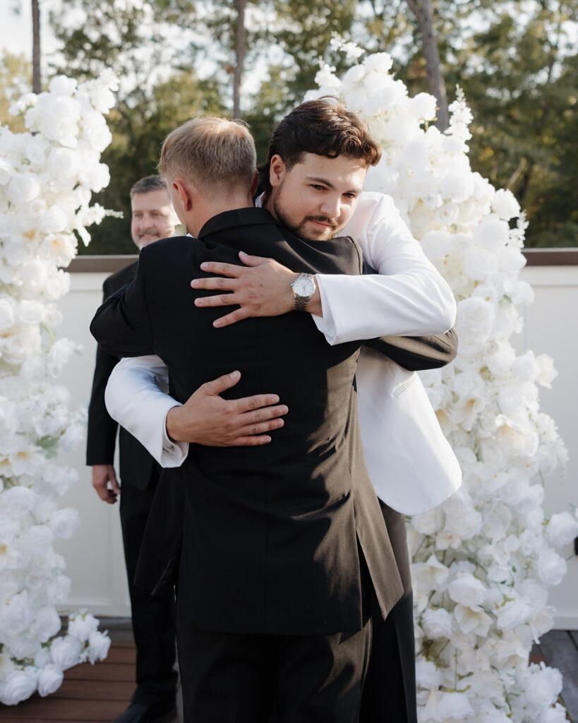 groom hugs his best man