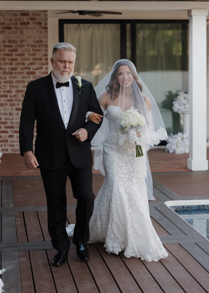 bride and father walk down the aisle