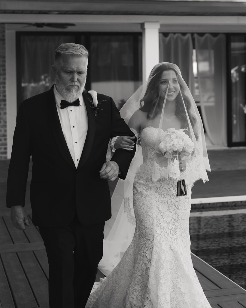 bride is escorted by her father