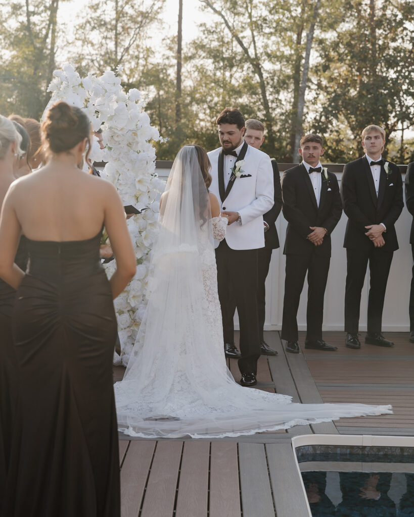 groom looks at woman