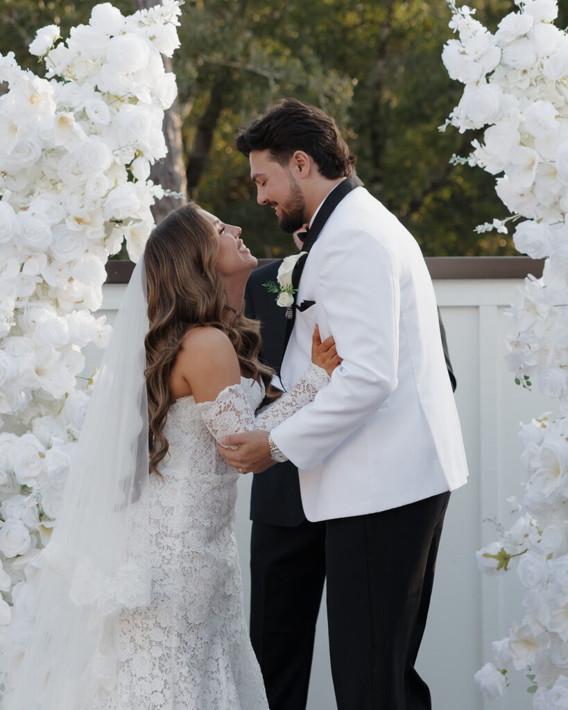 bride and groom smile