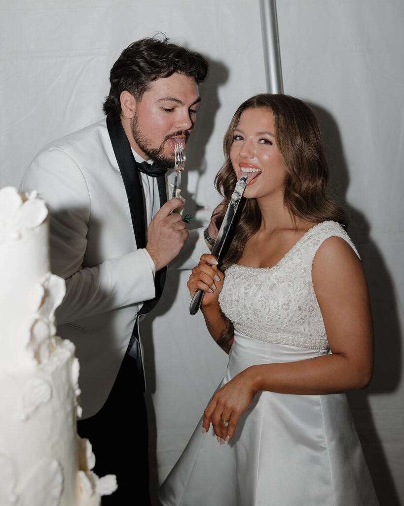 bride and groom cut their cake