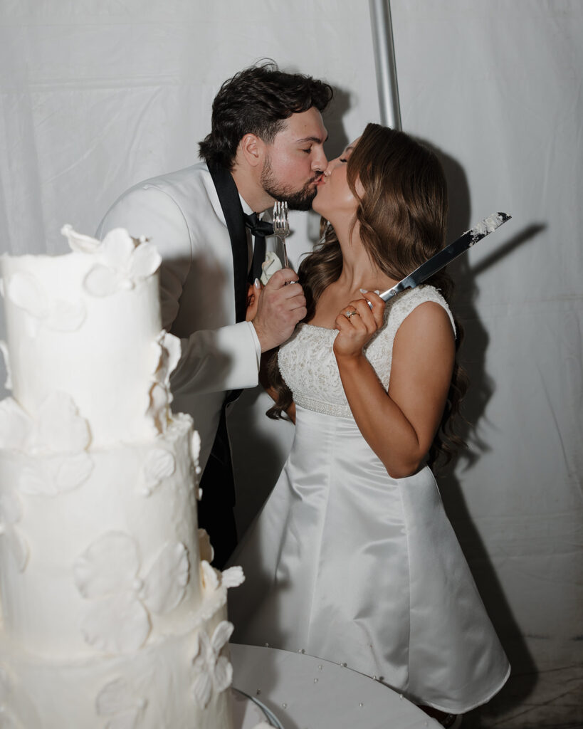 bride and groom cut their cake