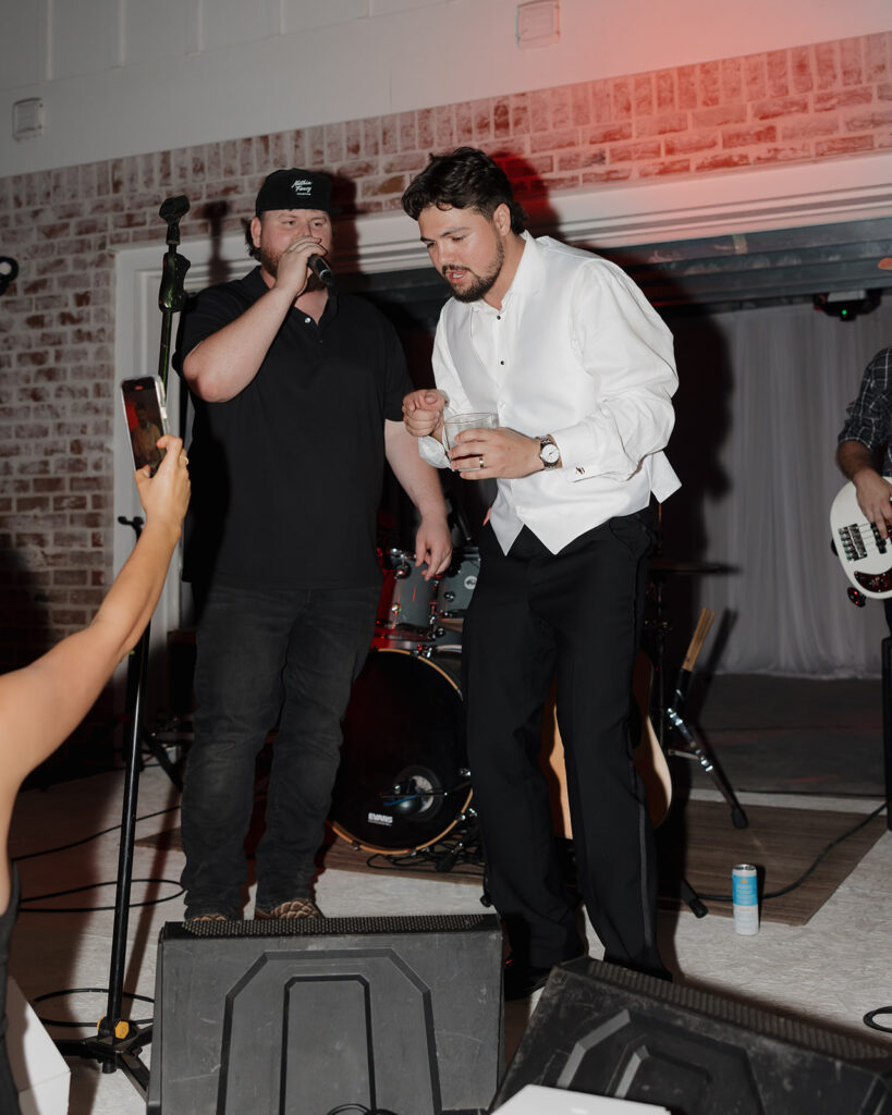 groom sings on stage