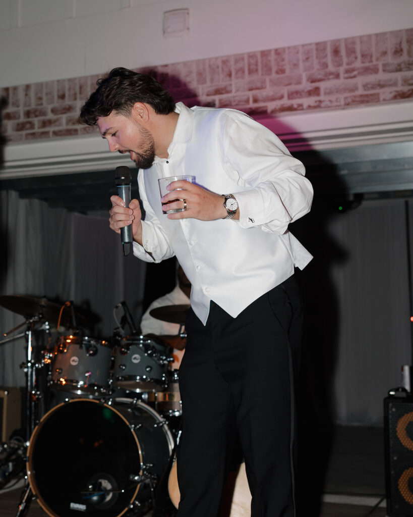 groom sings on stage