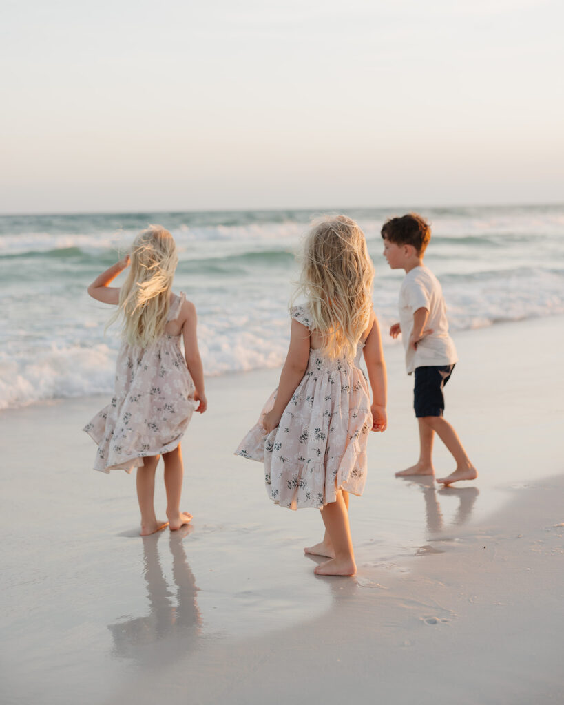 little children play on the beach