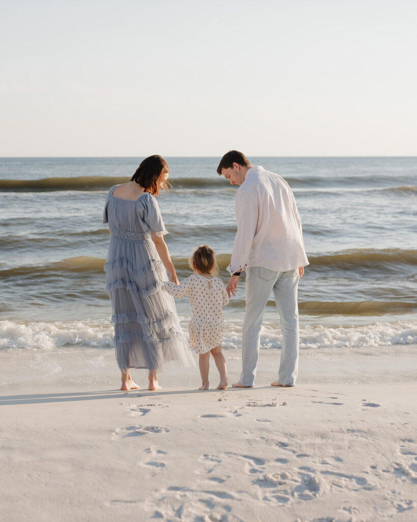 family walks along Santa Rosa Beach