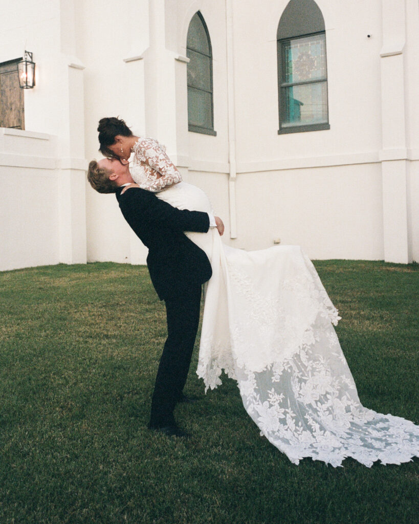 groom carries bride