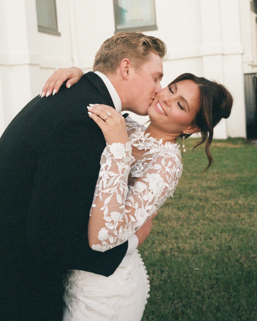 groom kisses bride's cheek