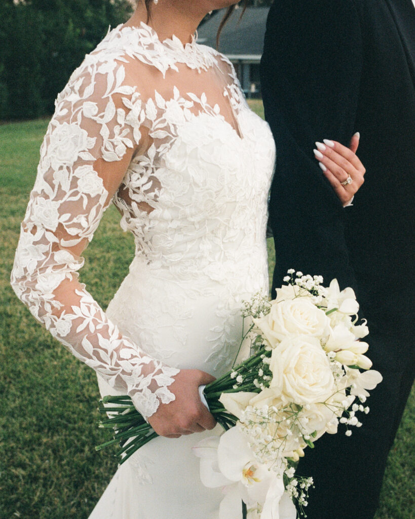 bride holds onto groom