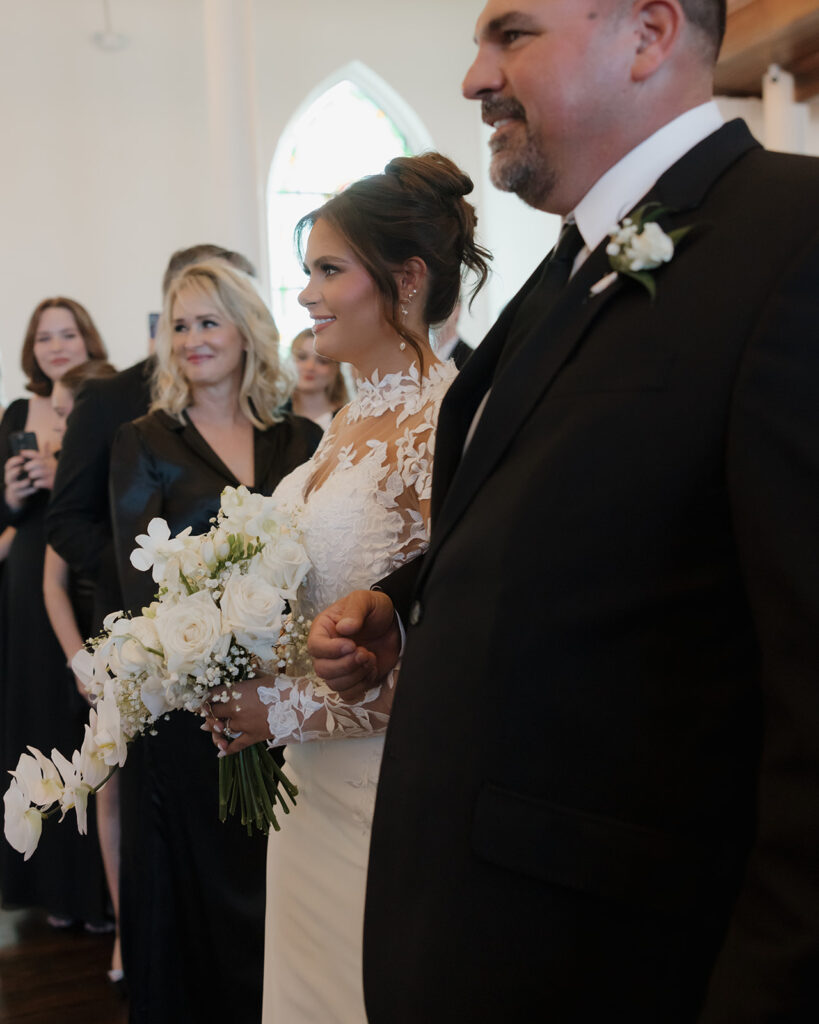 bride walks down the ceremony aisle