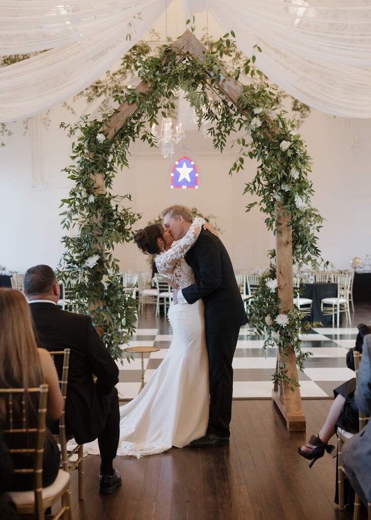 bride and groom kiss