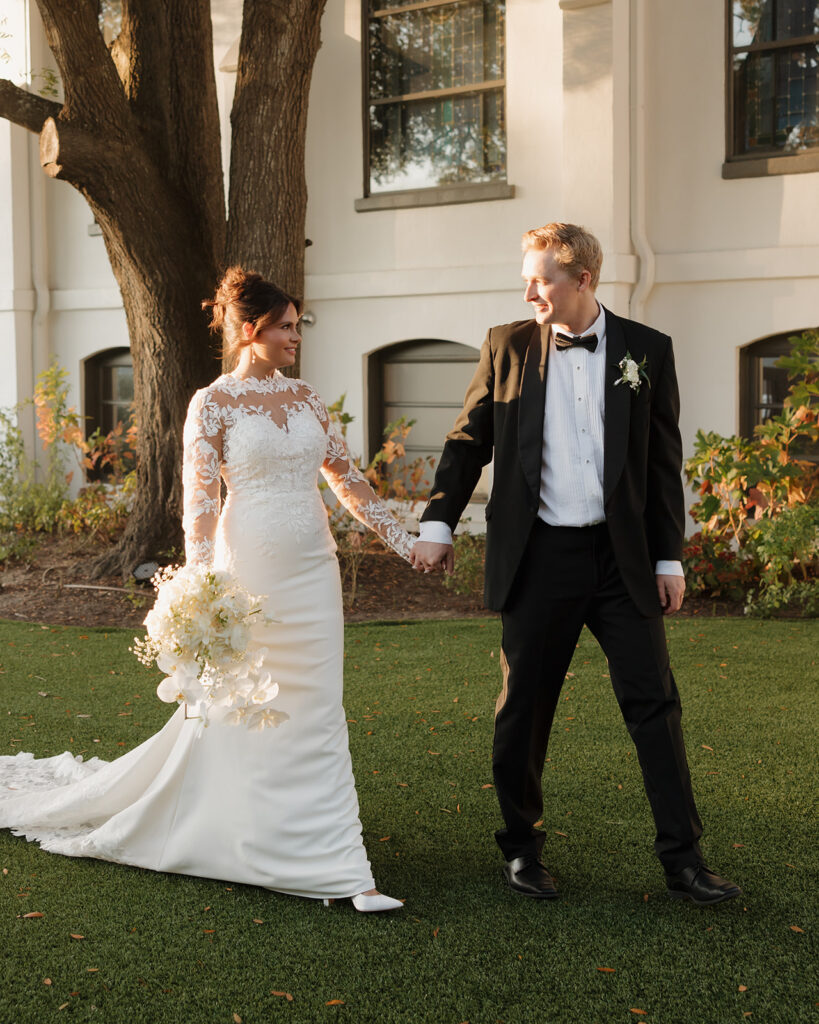 bride and groom walk around the Sanctuary event venue