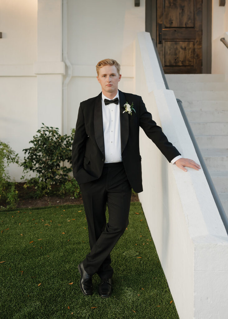 groom stand outside of the Sanctuary event venue