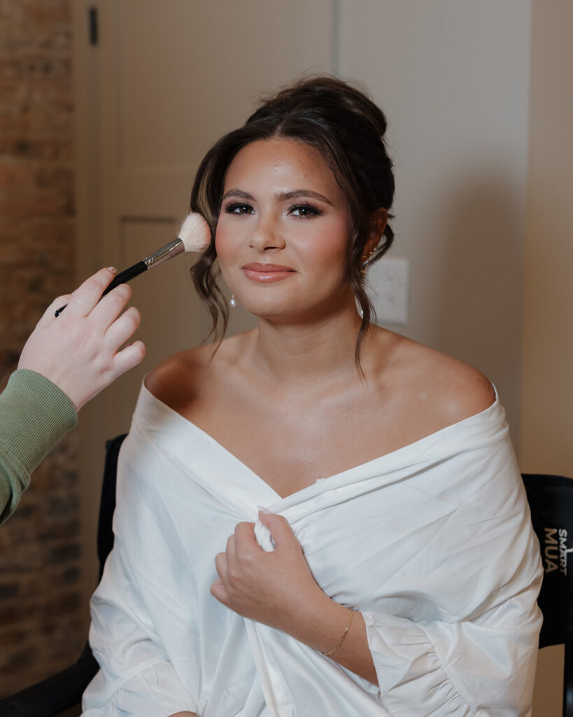 bride has makeup done