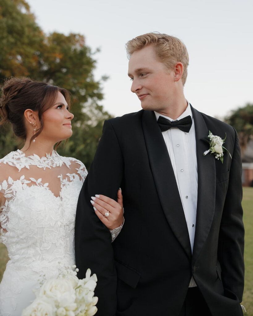 groom looks at his wife