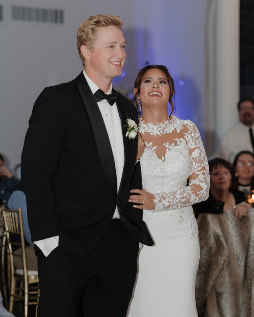 bride and groom smile