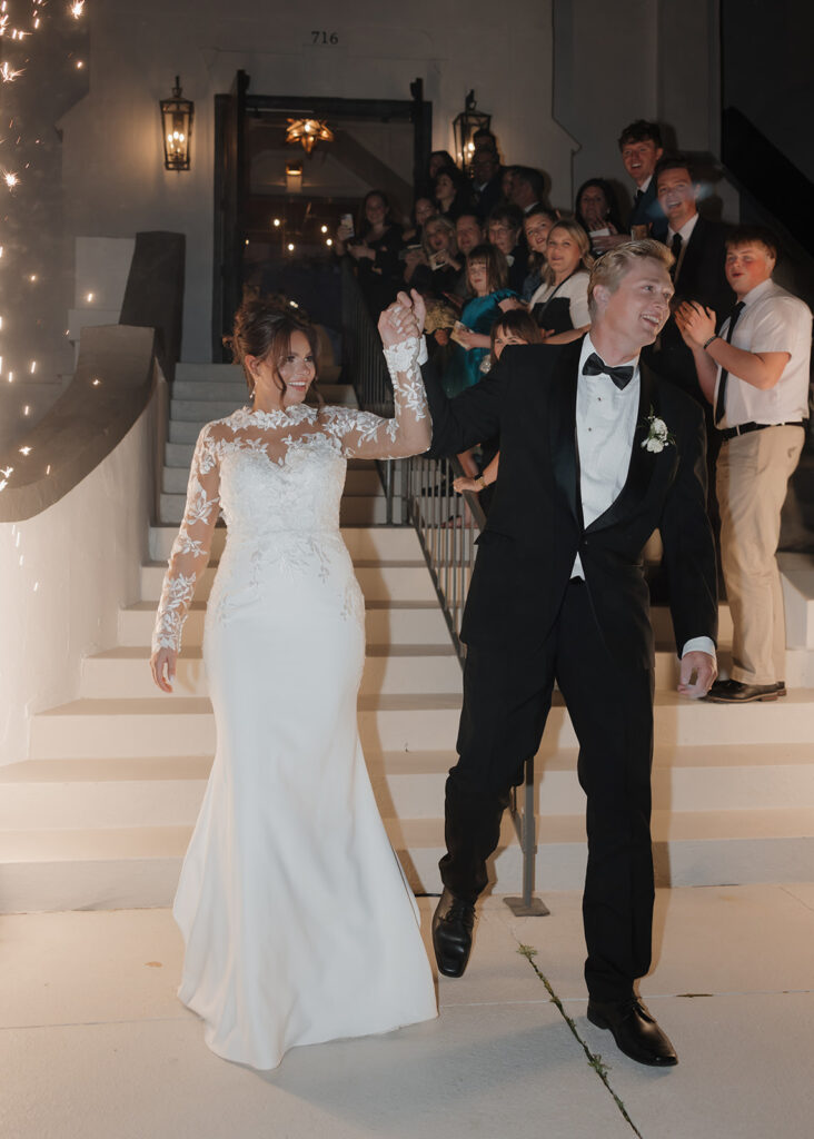 bride and groom leave with a sparkler send off