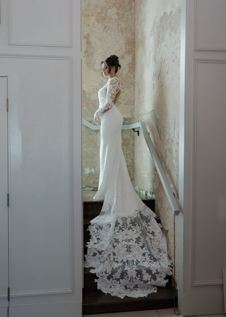 bride stands in the staircase