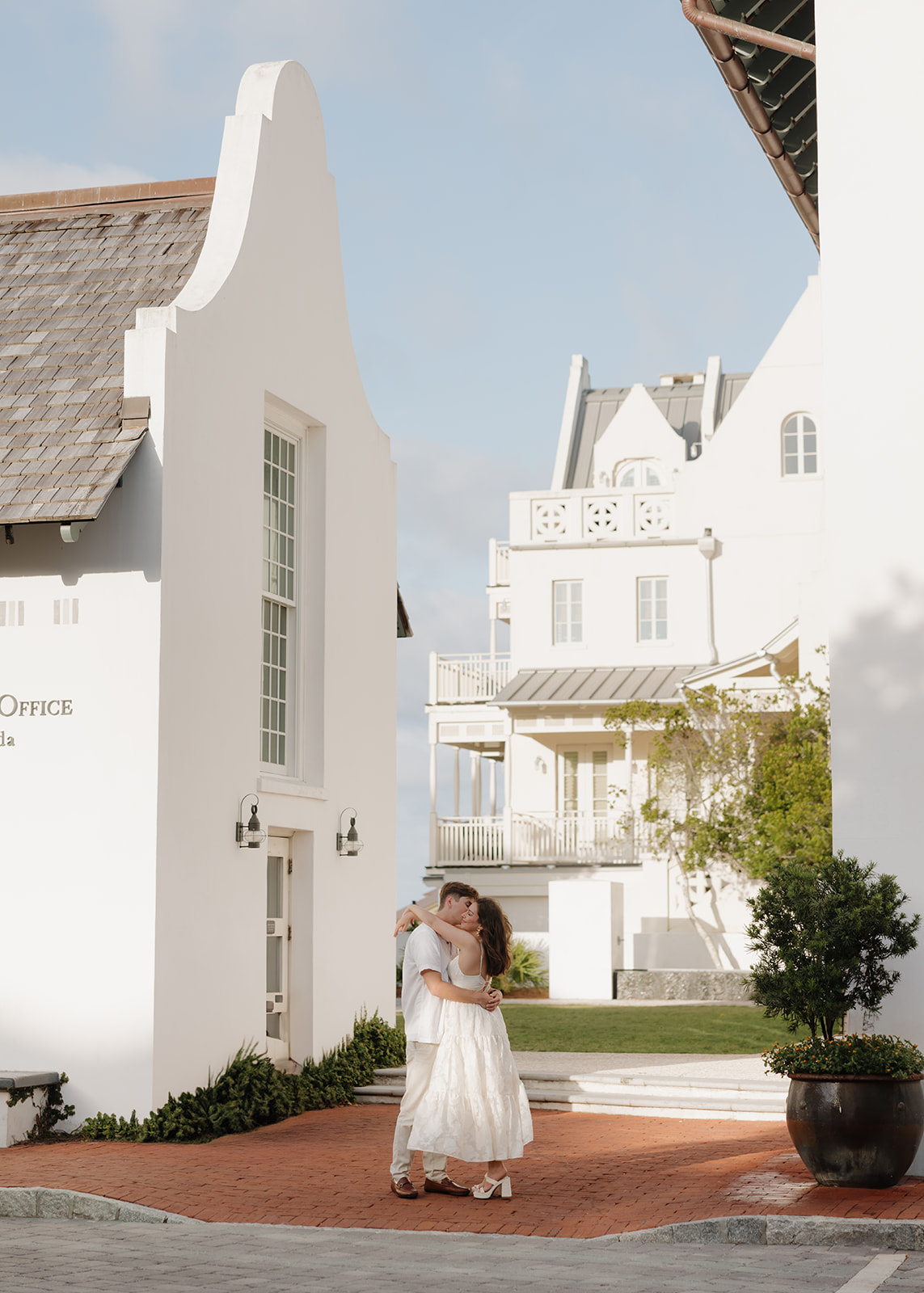 Bride and groom kiss by the Rosemary Beach town hall
