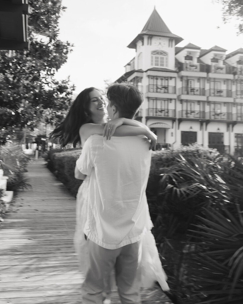 man and woman dance in front of the Pearl hotel