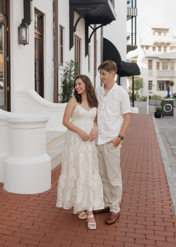 man and woman stand in front of the Rosemary beach hotel