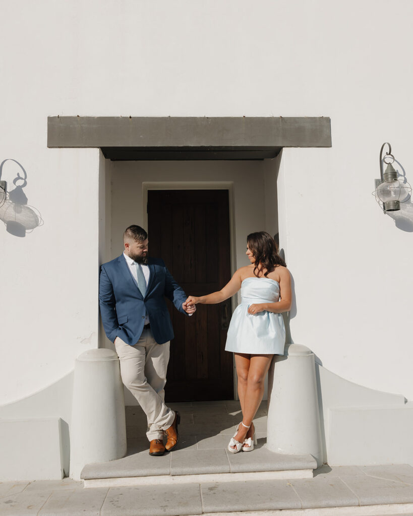 man and woman take engagement photos in 30A