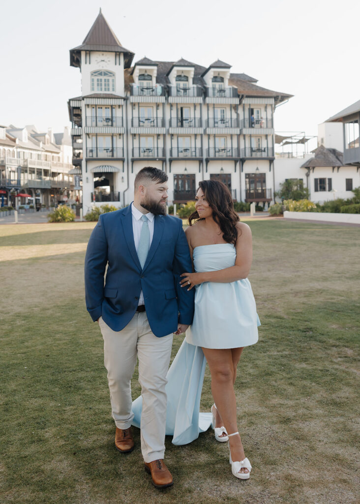 man and woman walk by the Pearl hotel