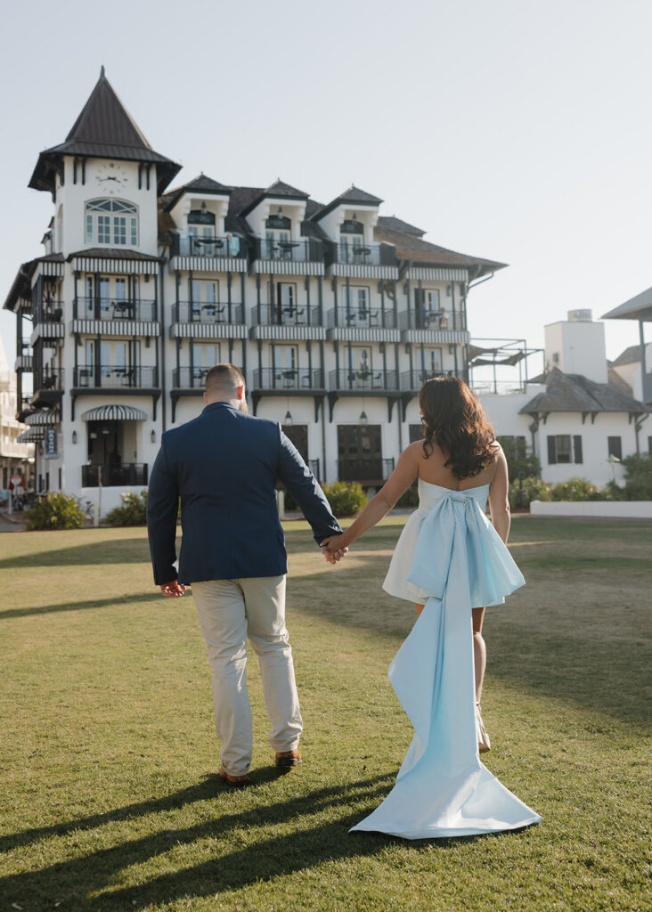 man and woman walk by the Pearl hotel