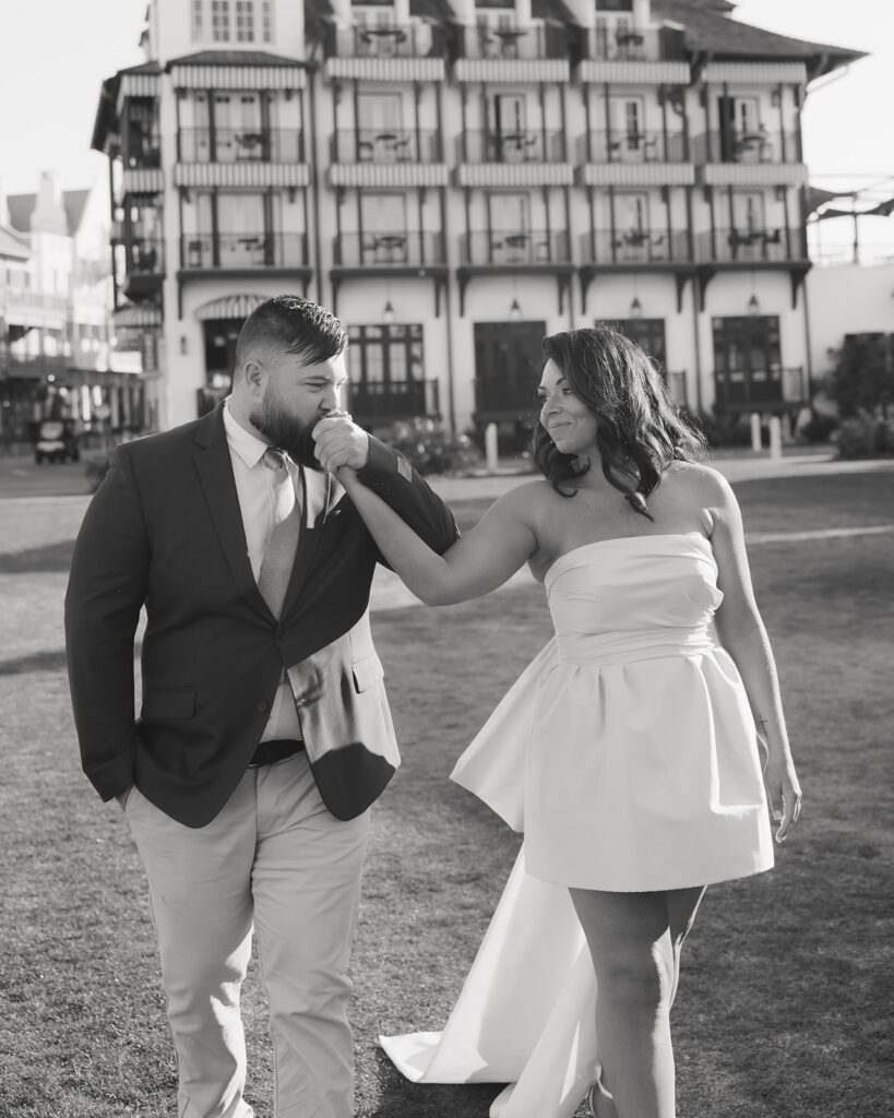 man kisses woman's hand