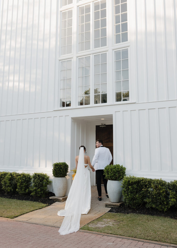 bride and groom walk into the Seaside chapel