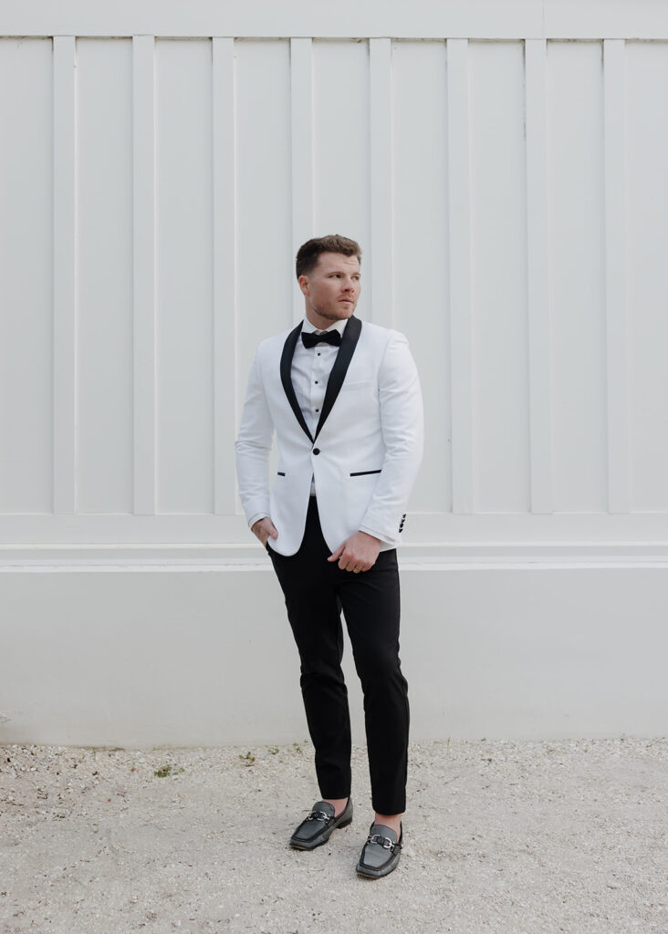 groom stands behind the chapel in Seaside Florida