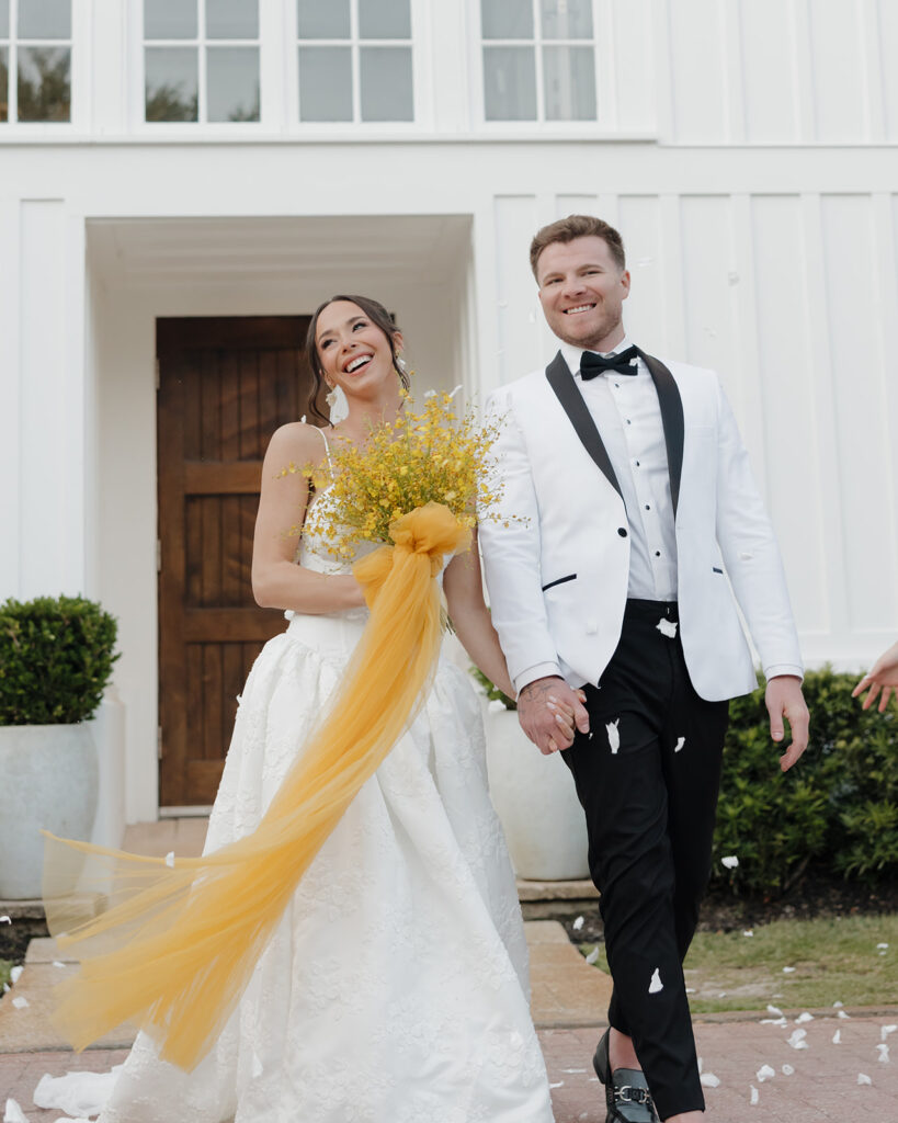 bride and groom exit the chapel at Seaside