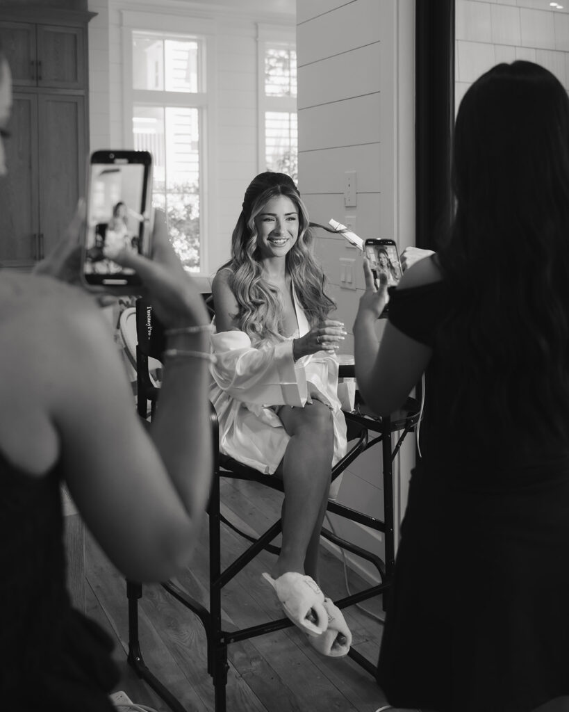 bride has hair and makeup done