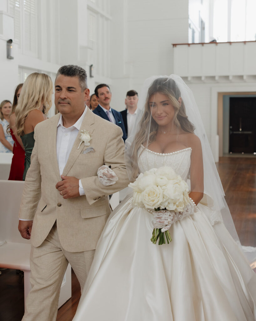 bride walks into the Seaside chapel