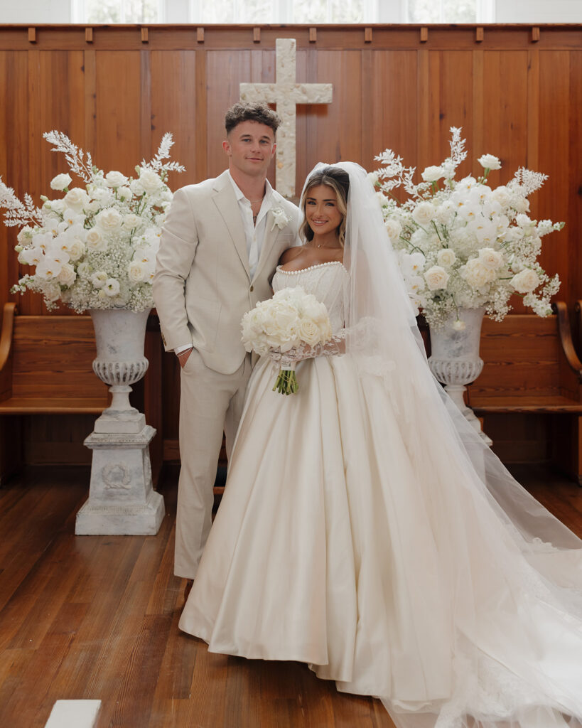 bride and groom smile in the Seaside Chapel