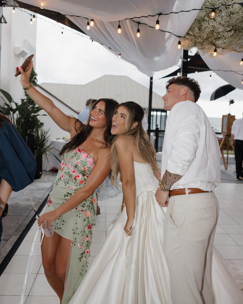 wedding guests take selfies