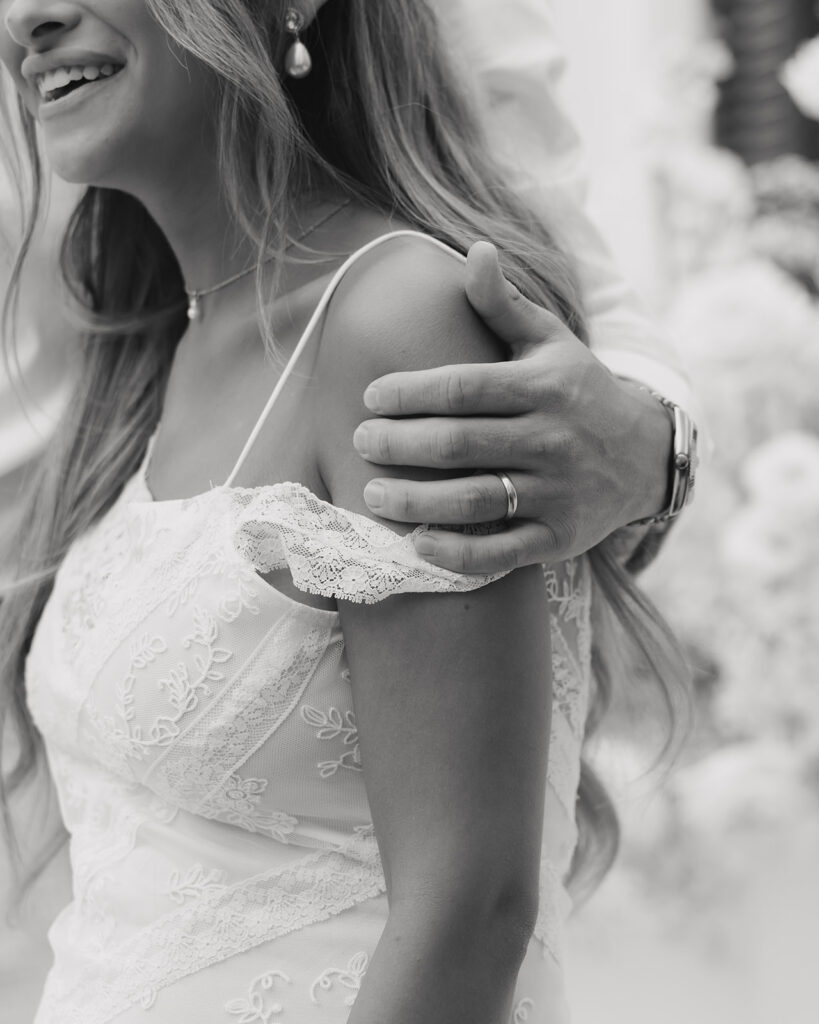 groom hugs bride